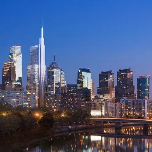 Philadelphia skyline at dusk, reflected in the river