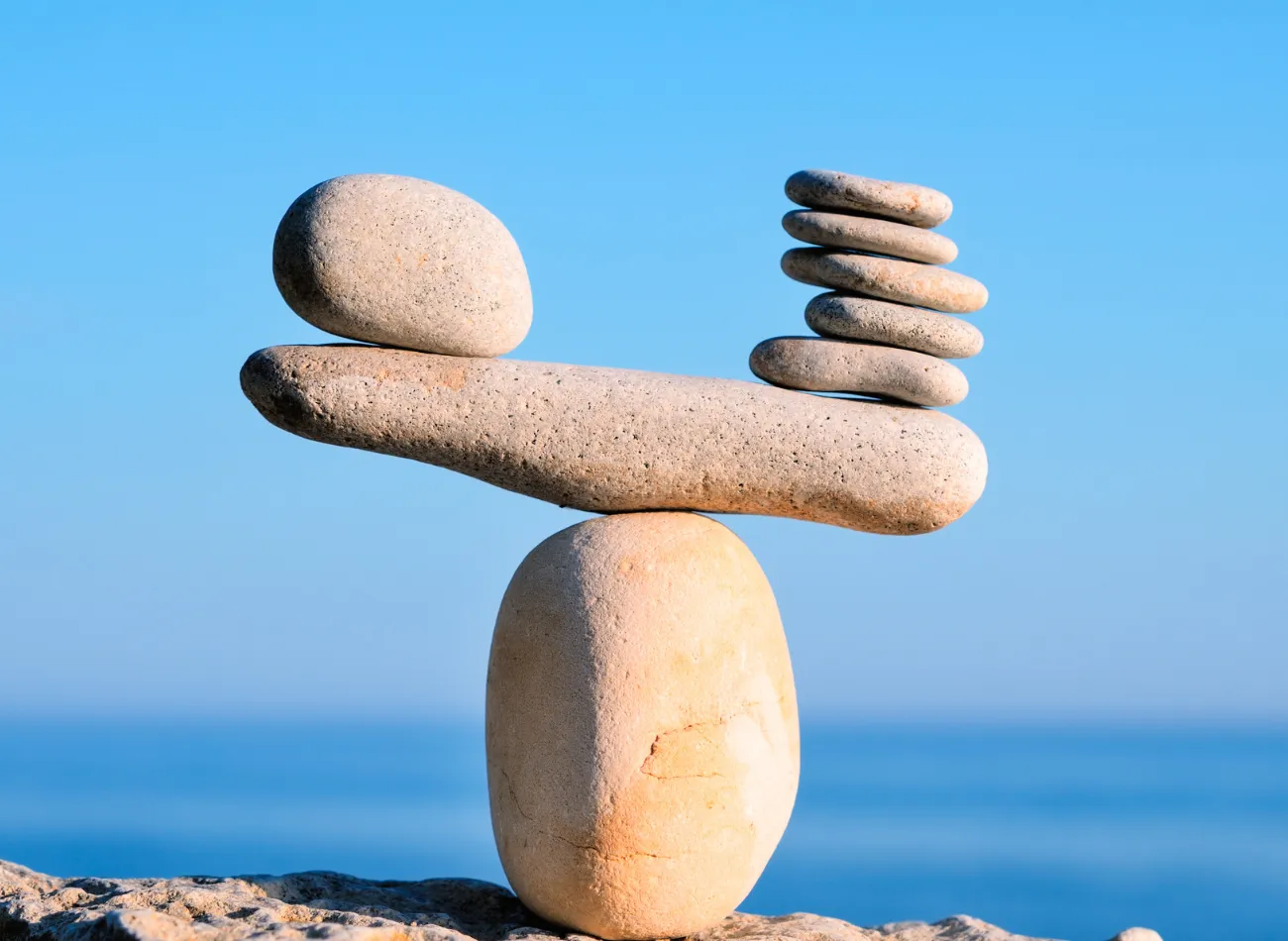 Stones balanced on top of one another by the sea